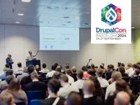 Image from the presentation at the drupal con in Barcelona 2024. In the image you see the crowd listening the talk of chrstian wiedemann